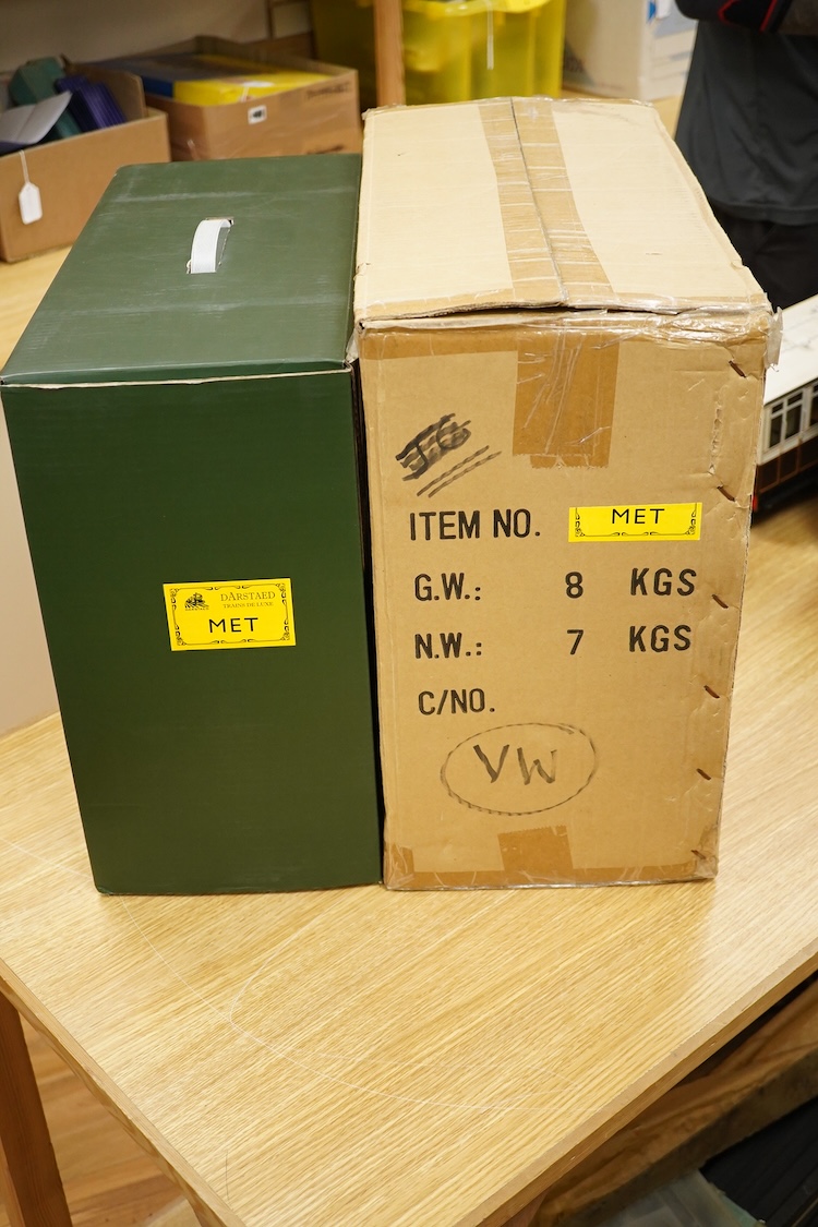 A boxed 0 gauge Darstaed tinplate Metropolitan Railway set of bogie coaches, a rake of five coaches in teak livery including; two Brake Thirds, two Full Thirds, and a Full First, fitted with internal lighting throughout